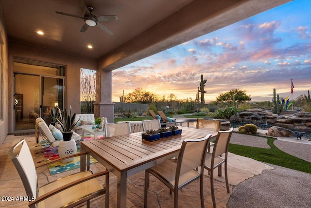 patio terrace at dusk with ceiling fan