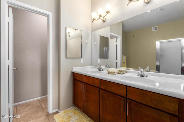 full bathroom featuring tile patterned floors, vanity, toilet, and shower / tub combo with curtain