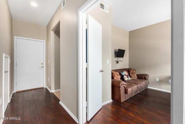 living room featuring a tile fireplace, ceiling fan, a healthy amount of sunlight, and wood-type flooring