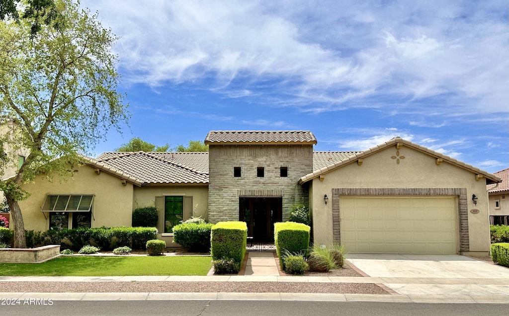 mediterranean / spanish-style home featuring a garage