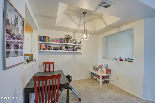 view of carpeted dining space