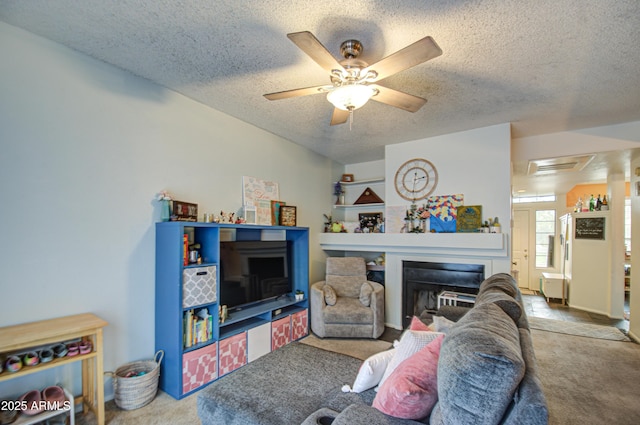 13842 S 40th St Unit 1004, Phoenix, AZ 85044 - living room with ceiling fan, carpet floors, and a textured ceiling