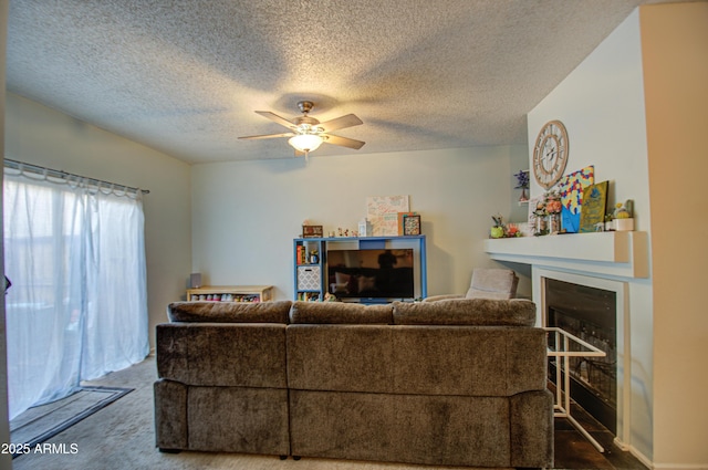 13842 S 40th St Unit 1004, Phoenix, AZ 85044 - living room featuring ceiling fan, a textured ceiling, and carpet