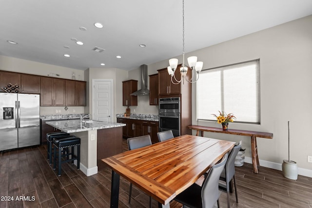 4240 Blacksmith Way, Wickenburg, AZ 85390 - dining area with a chandelier, recessed lighting, dark wood-type flooring, and baseboards