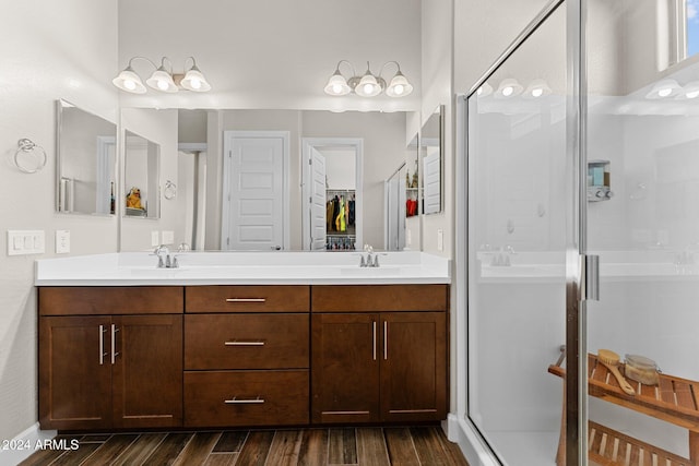 4240 Blacksmith Way, Wickenburg, AZ 85390 - full bathroom featuring a shower stall, double vanity, wood finished floors, and a closet