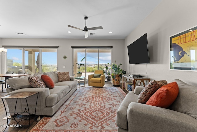 4240 Blacksmith Way, Wickenburg, AZ 85390 - living room featuring wood finished floors, a ceiling fan, plenty of natural light, and recessed lighting