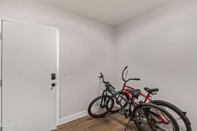 exercise area with dark hardwood / wood-style floors