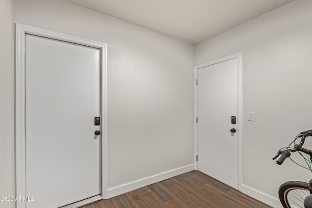 entrance foyer with dark hardwood / wood-style floors