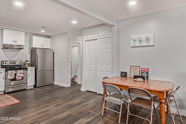 dining area with dark hardwood / wood-style floors