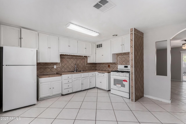 kitchen featuring white cabinetry, sink, white appliances, and ceiling fan