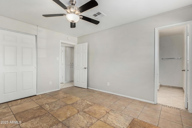 unfurnished bedroom featuring ceiling fan and a closet