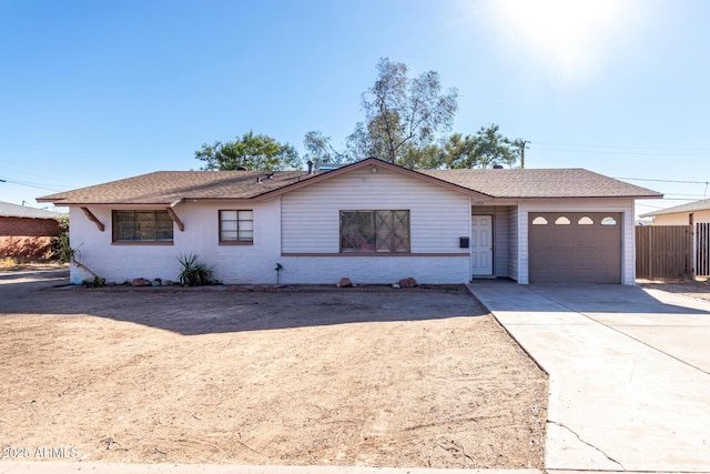 ranch-style house featuring a garage