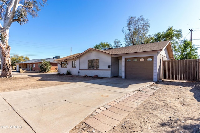 ranch-style home featuring a garage