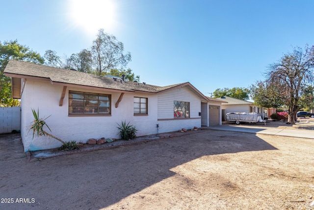 single story home with a garage