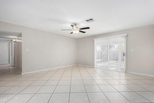 empty room featuring ceiling fan and light tile patterned floors