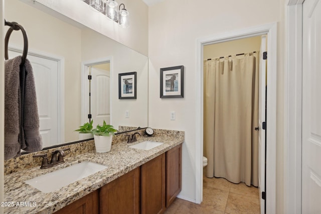 4772 E Portola Valley Dr Unit 102, Gilbert, AZ 85297 - bathroom with toilet, double vanity, and tile patterned flooring