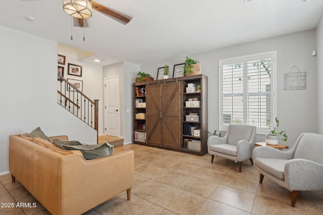 4772 E Portola Valley Dr Unit 102, Gilbert, AZ 85297 - living room with ceiling fan, stairway, light tile patterned floors, recessed lighting, and baseboards