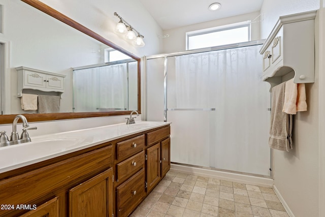 bathroom with vanity and walk in shower