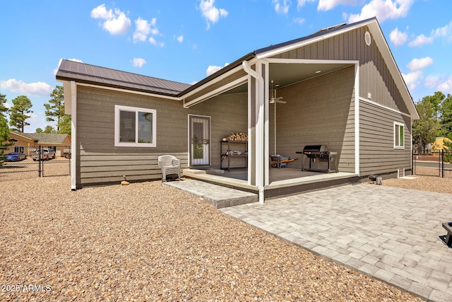 460 S Mountaine Pines Ave, Show Low, AZ 85901 - back of house featuring a patio area and a metal roof