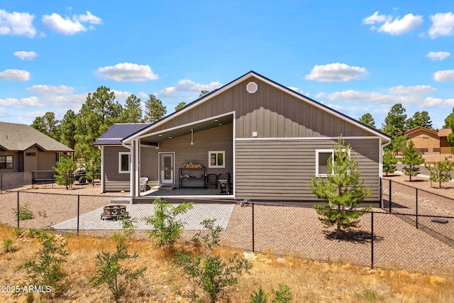 460 S Mountaine Pines Ave, Show Low, AZ 85901 - rear view of property with an outdoor fire pit and a patio area
