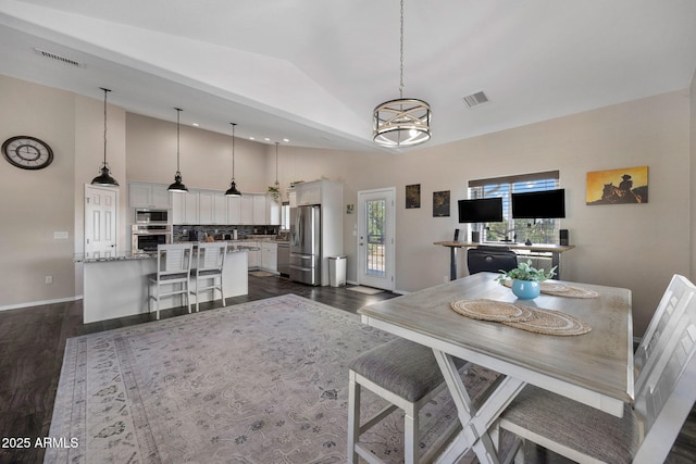 460 S Mountaine Pines Ave, Show Low, AZ 85901 - dining space featuring dark wood finished floors, high vaulted ceiling, and a chandelier