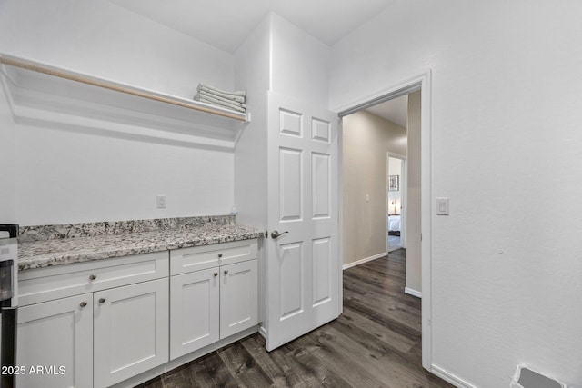 460 S Mountaine Pines Ave, Show Low, AZ 85901 - bar area featuring dark wood-type flooring and baseboards