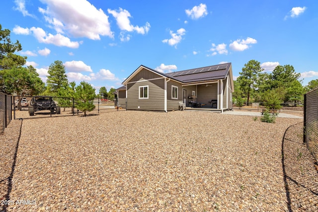 460 S Mountaine Pines Ave, Show Low, AZ 85901 - back of house featuring a gate, roof mounted solar panels, a fenced backyard, a patio, and a ceiling fan