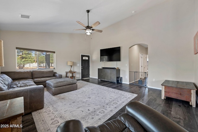 460 S Mountaine Pines Ave, Show Low, AZ 85901 - living area with dark wood-style flooring, ceiling fan, arched walkways, and high vaulted ceiling