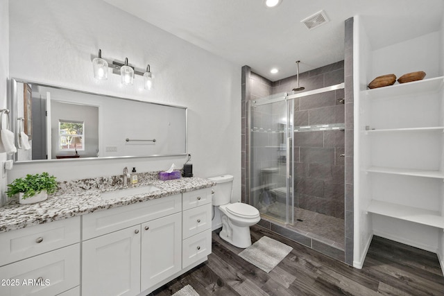 460 S Mountaine Pines Ave, Show Low, AZ 85901 - full bathroom featuring vanity, a shower stall, wood finished floors, and recessed lighting