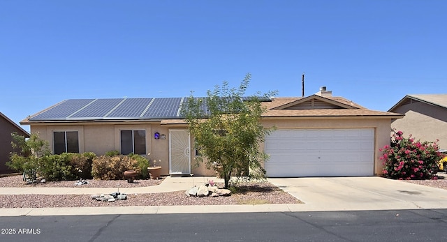 804 W Hess Ave, Coolidge, AZ 85128 - ranch-style house with roof mounted solar panels, concrete driveway, a garage, and stucco siding
