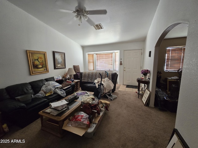 804 W Hess Ave, Coolidge, AZ 85128 - carpeted living area featuring arched walkways, ceiling fan, and lofted ceiling