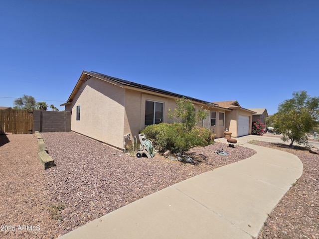 804 W Hess Ave, Coolidge, AZ 85128 - view of property exterior with stucco siding, an attached garage, and concrete driveway