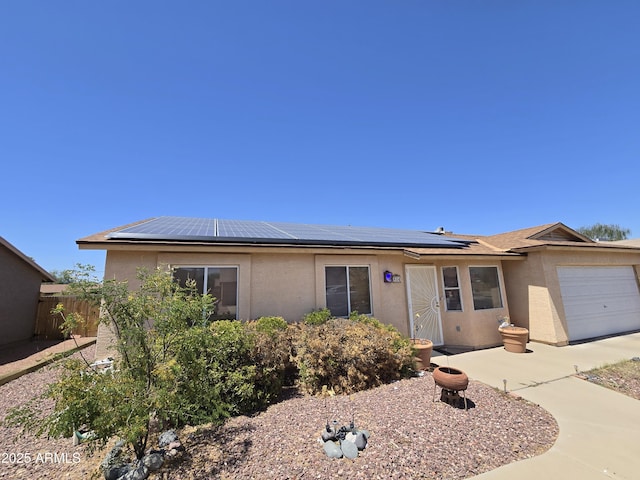 804 W Hess Ave, Coolidge, AZ 85128 - ranch-style house featuring an attached garage, stucco siding, and solar panels