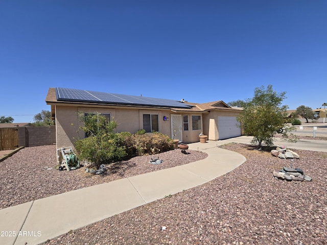 804 W Hess Ave, Coolidge, AZ 85128 - ranch-style house with stucco siding, an attached garage, and roof mounted solar panels