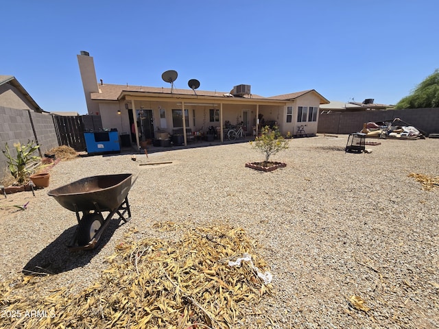 804 W Hess Ave, Coolidge, AZ 85128 - rear view of property with a fenced backyard, a chimney, and a patio area