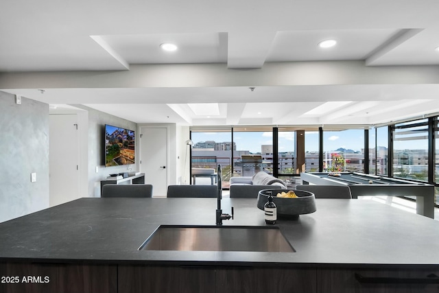 kitchen featuring open floor plan, recessed lighting, billiards, and a sink