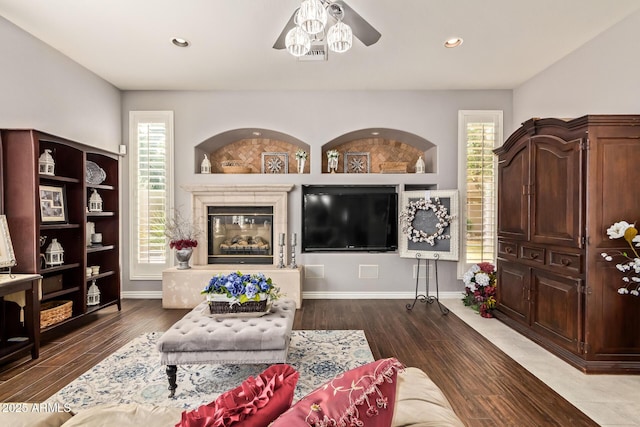 living room with recessed lighting, baseboards, ceiling fan, and wood finished floors