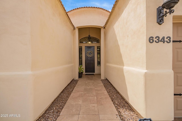 doorway to property with stucco siding