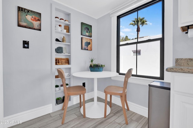 dining room featuring built in shelves