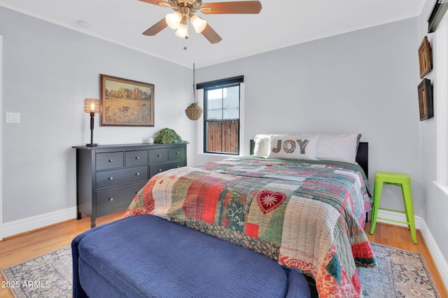 bedroom featuring hardwood / wood-style floors and ceiling fan