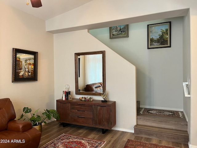 interior space with hardwood / wood-style flooring, ceiling fan, and vaulted ceiling