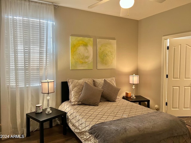 bedroom featuring hardwood / wood-style flooring and ceiling fan