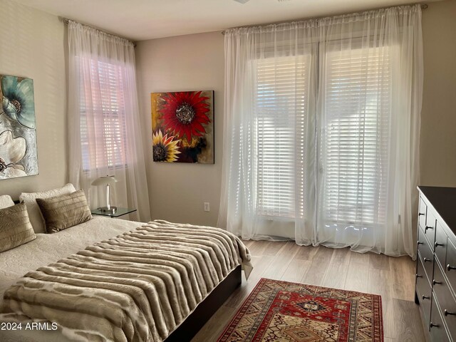 bedroom with hardwood / wood-style floors