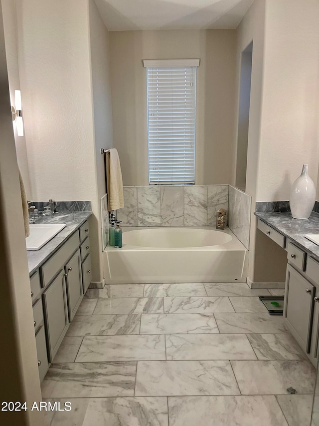 bathroom with vanity and a tub to relax in