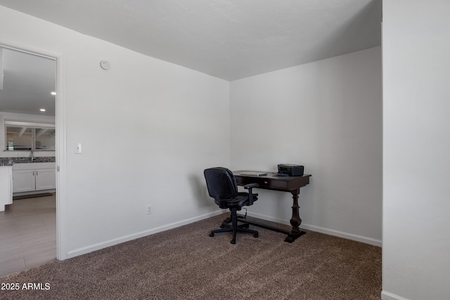 8425 E Hawthorne St, Tucson, AZ 85710 - home office with carpet flooring, baseboards, and a sink