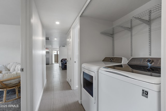 8425 E Hawthorne St, Tucson, AZ 85710 - laundry area featuring washer and clothes dryer, recessed lighting, and baseboards