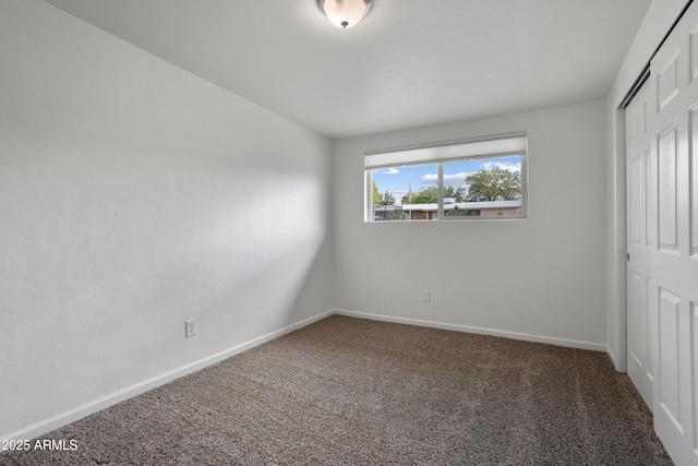 8425 E Hawthorne St, Tucson, AZ 85710 - unfurnished bedroom with carpet floors, a closet, and baseboards