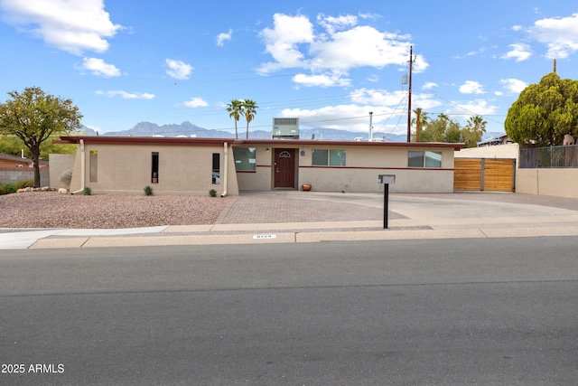 8425 E Hawthorne St, Tucson, AZ 85710 - single story home featuring a mountain view and fence