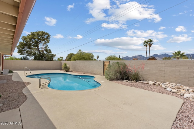 8425 E Hawthorne St, Tucson, AZ 85710 - view of pool with a fenced backyard, a patio, and a mountain view