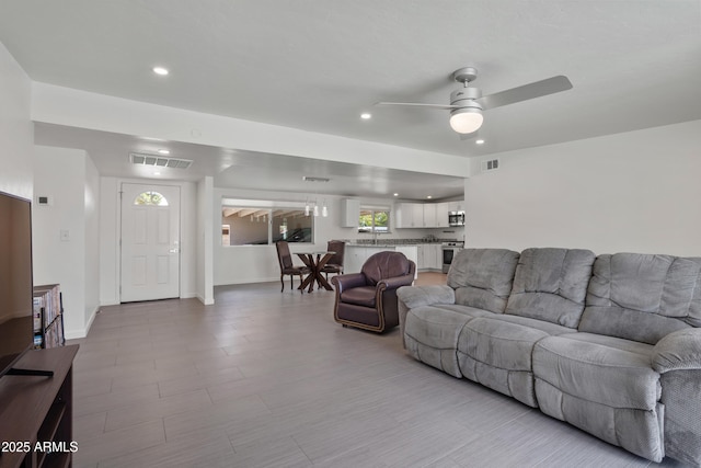 8425 E Hawthorne St, Tucson, AZ 85710 - living area with ceiling fan, recessed lighting, and baseboards